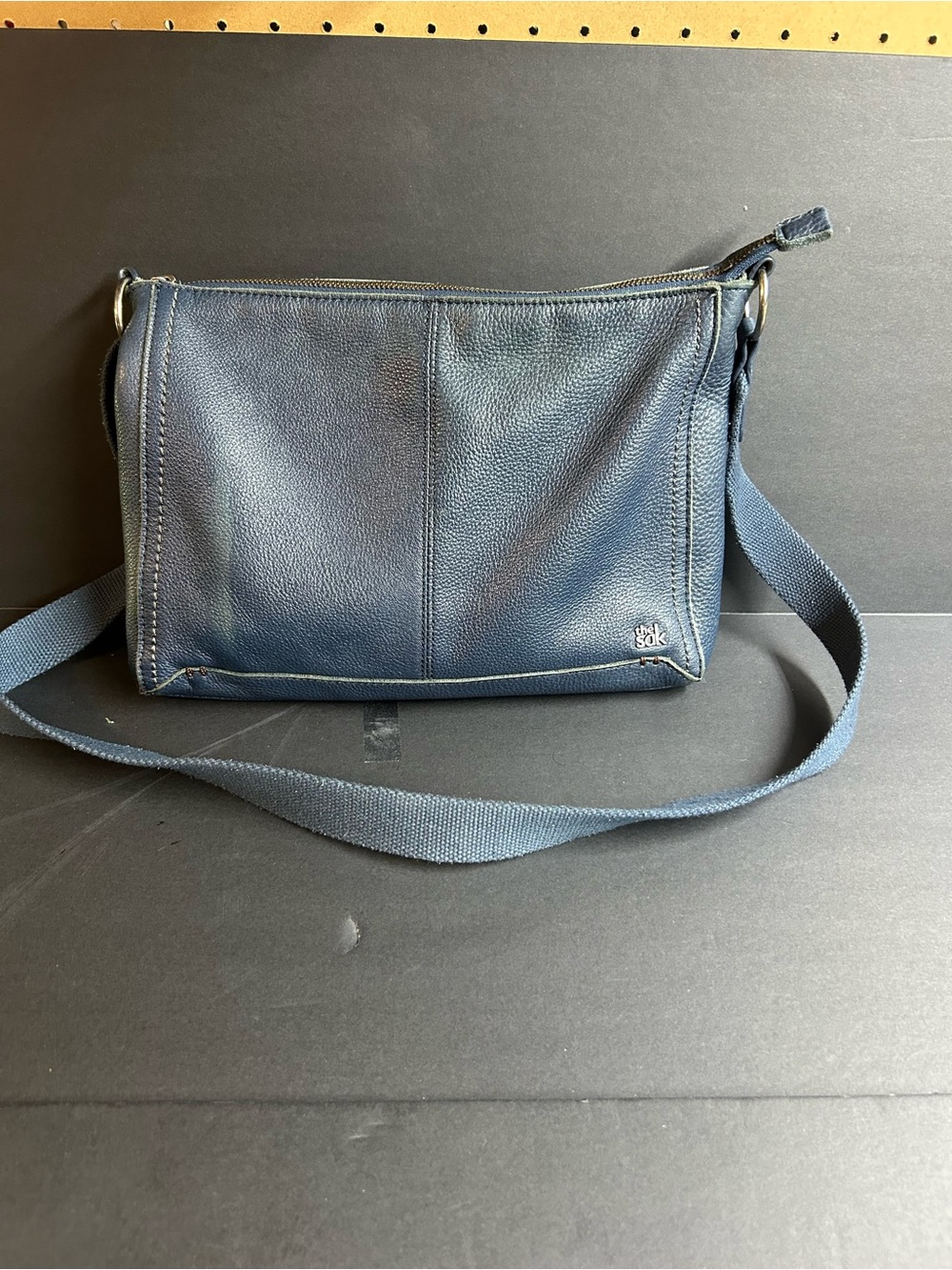 The Sak Navy Leather Crossbody with Mint Interior